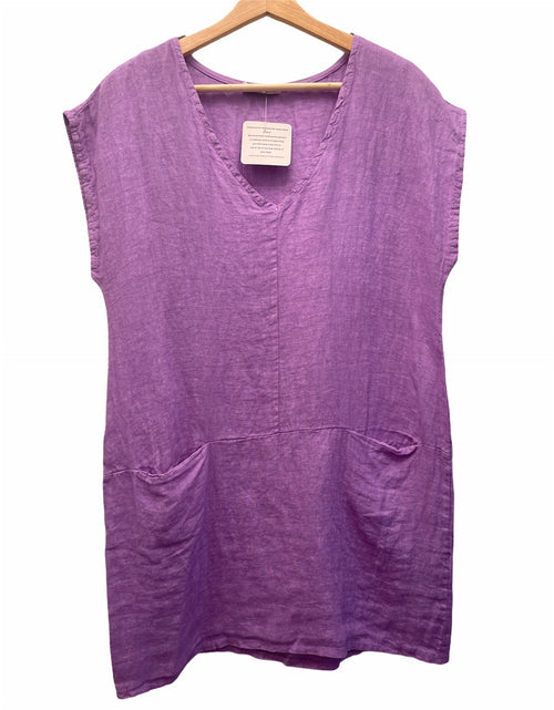lilac top/dress depending on your height with two pockets in the front and a v neck neckline. There is a slight sleeve