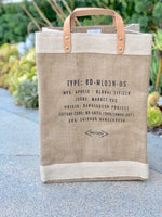 The back of the market bag has manufacturing information printed in black.