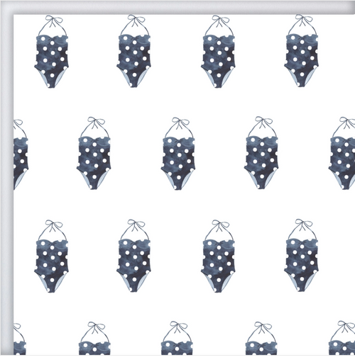 A sheet of white wrapping paper with navy blue and white polka dot bathing suits printed in a repetitive pattern.