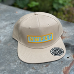 Khaki 6-panel canvas hat with snapback canvas back by NWPRT with a NWPRT patch.